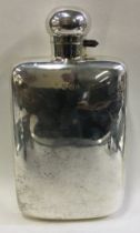 A large silver flask with screw-top lid.