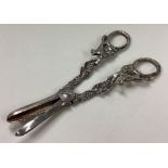 A pair of silver grape scissors cast with foxes.