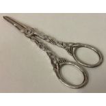 A pair of Continental silver grape scissors with vine decoration.