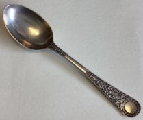 EXETER: An unusual silver preserve spoon.