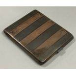 A heavy silver and gold mounted cigarette case.