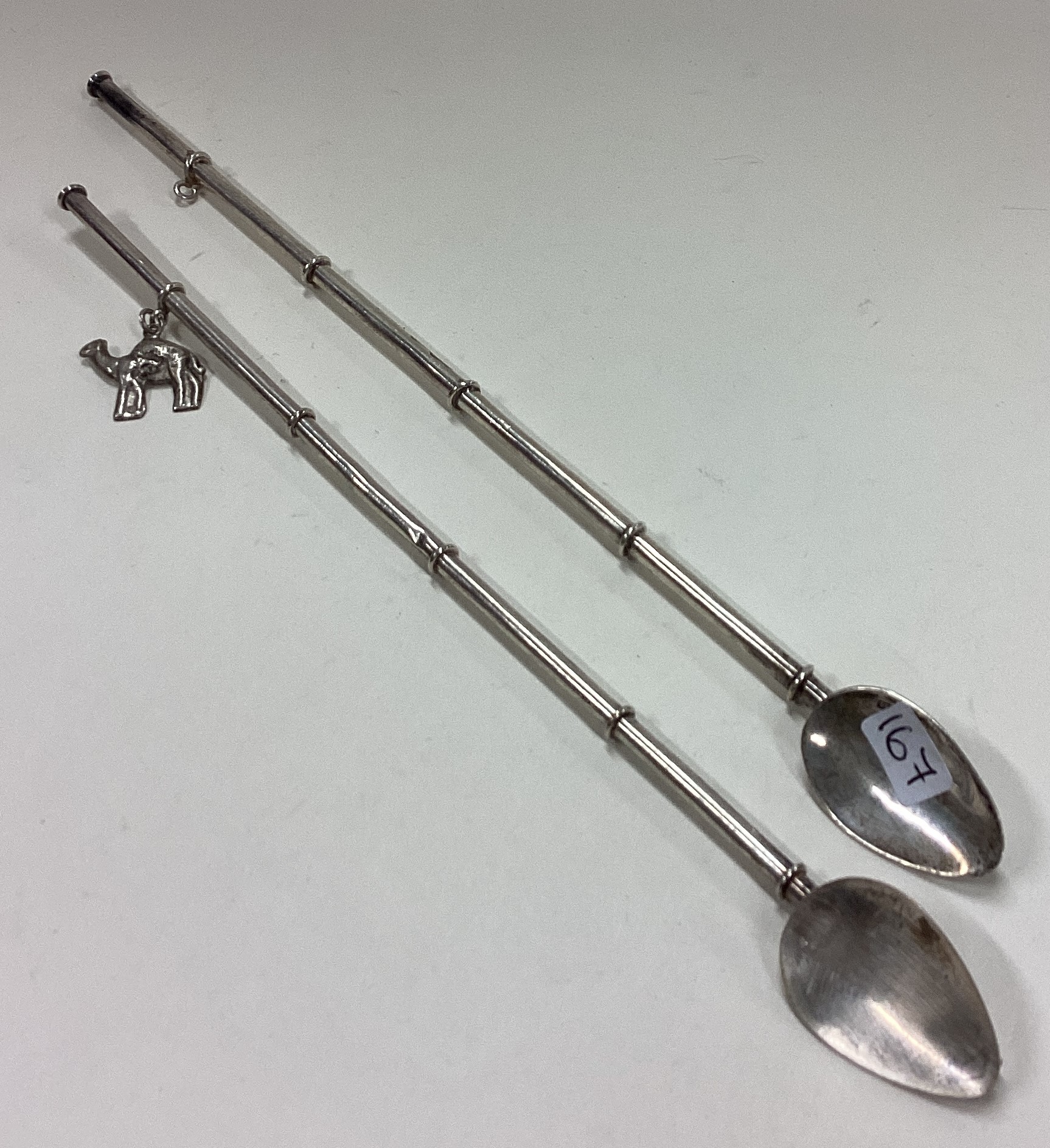 A pair of Sterling silver cocktail stirrers / straws.