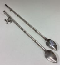 A pair of Sterling silver cocktail stirrers / straws.