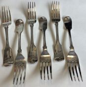 EXETER: A heavy set of six silver fiddle pattern table forks.