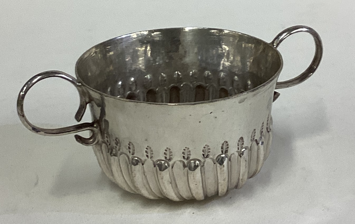 A William III silver porringer. London 1700.