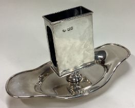 A large Victorian silver match holder on stand.