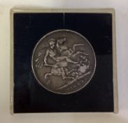 A cased 1889 Victorian silver coin.