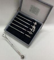 A rare cased set of six Japanese silver swizzle sticks.