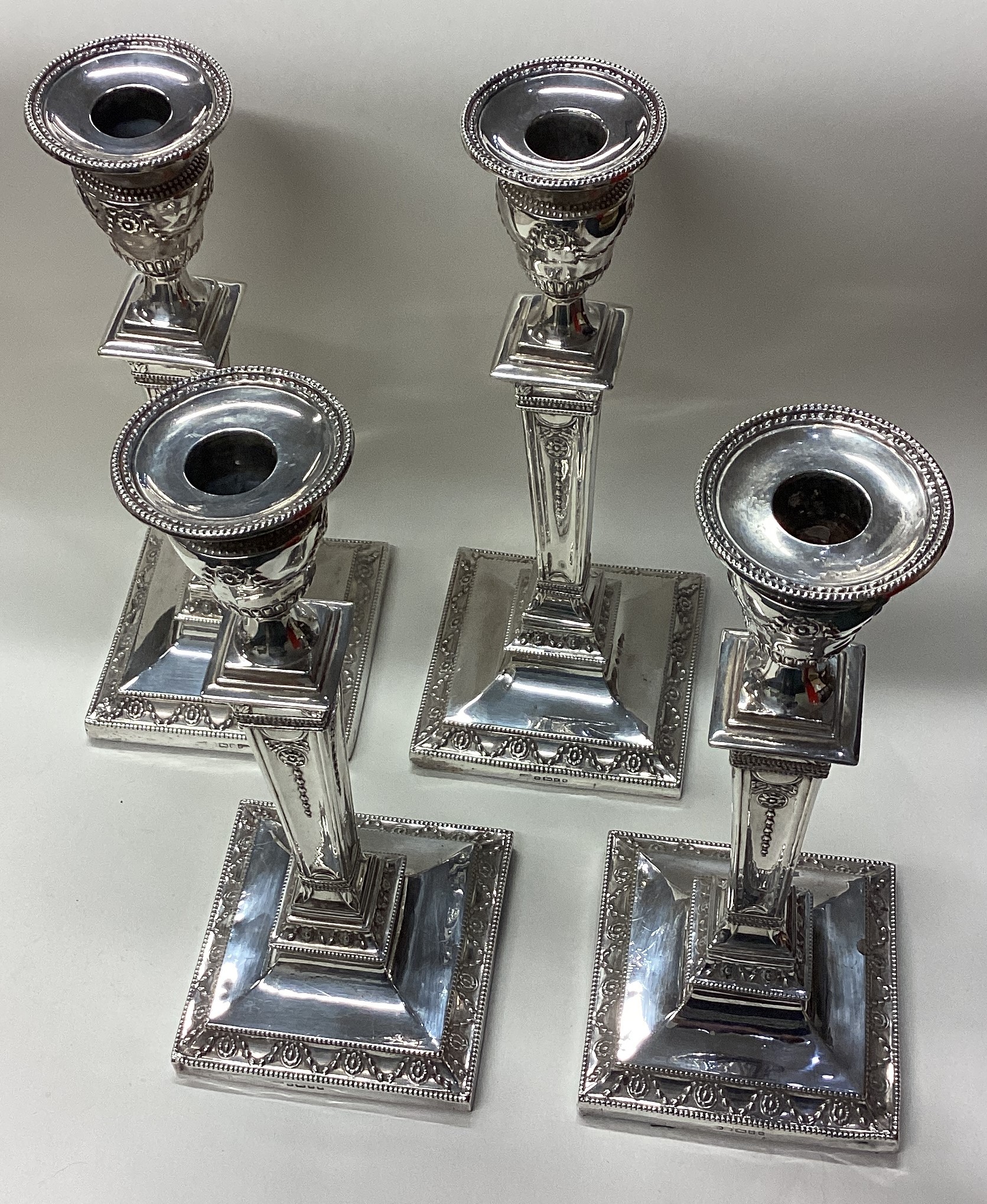 A rare and fine set of four Victorian silver candlesticks. - Image 4 of 5