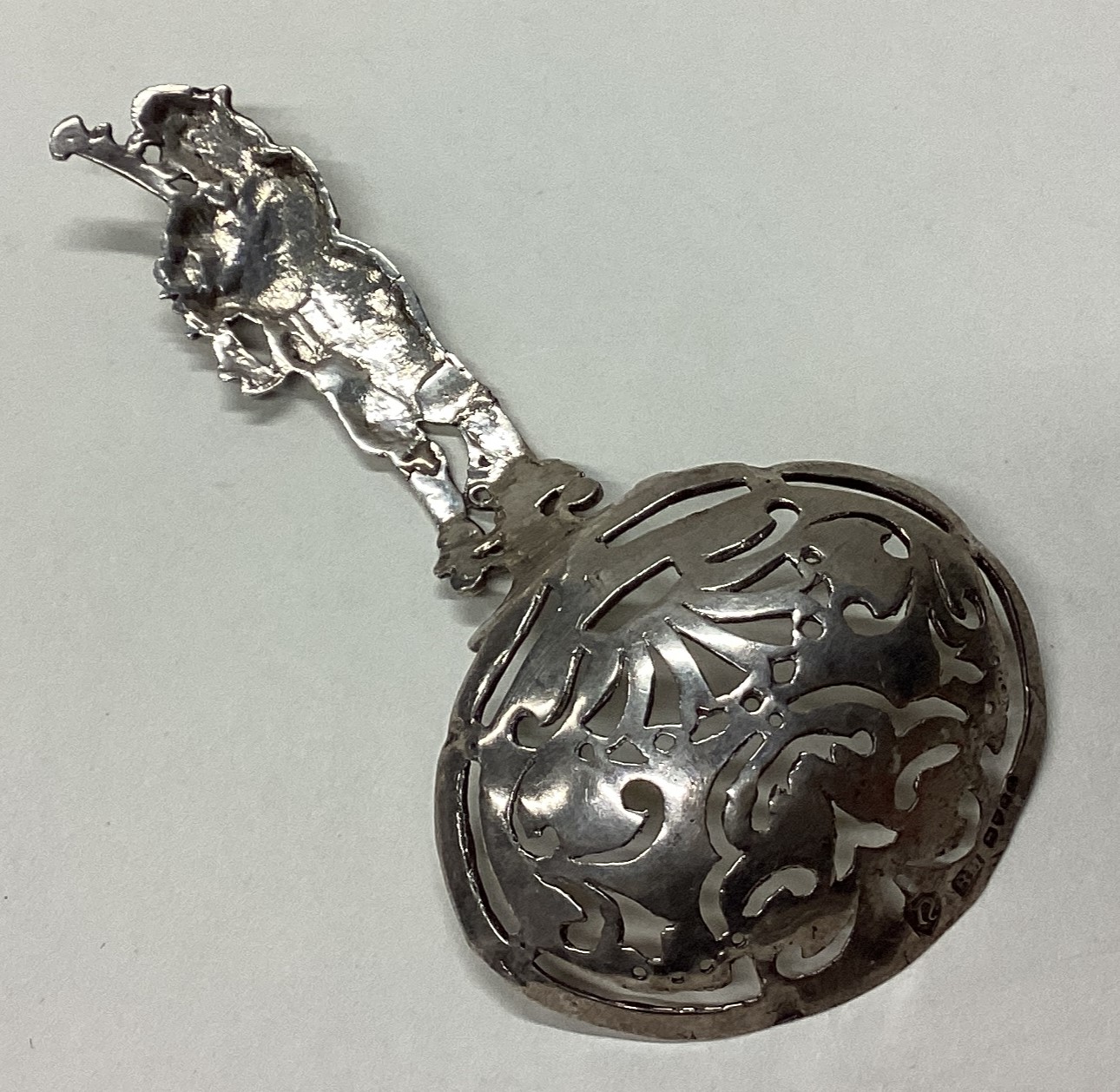 A silver sifter spoon with figural handle. - Image 2 of 3