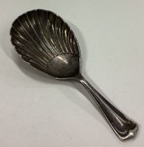 A silver plated fluted caddy spoon.