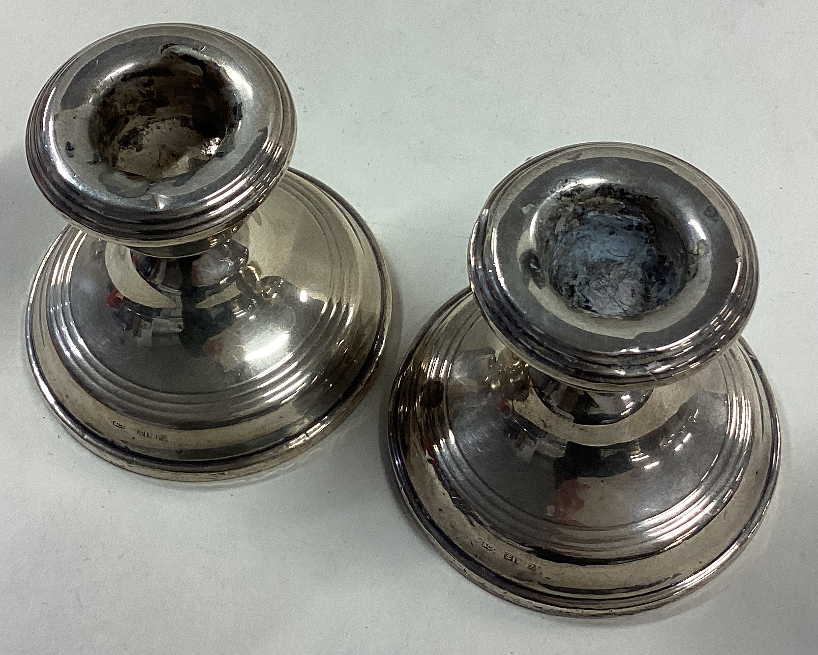 A pair of silver piano candlesticks. - Image 2 of 2
