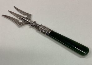 A silver three prong fork with agate handle.