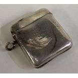 A Victorian silver vesta case with central armorial.