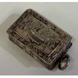 A Victorian silver vinaigrette decorated with basket of flowers.