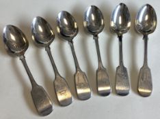EXETER: A heavy matched set of six silver fiddle pattern dessert spoons.