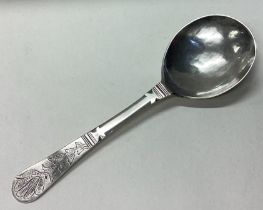 An 18th Century Norwegian silver spoon with engraved floral decoration to terminal.
