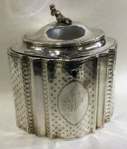 An 18th Century Georgian silver chinoiserie tea caddy.