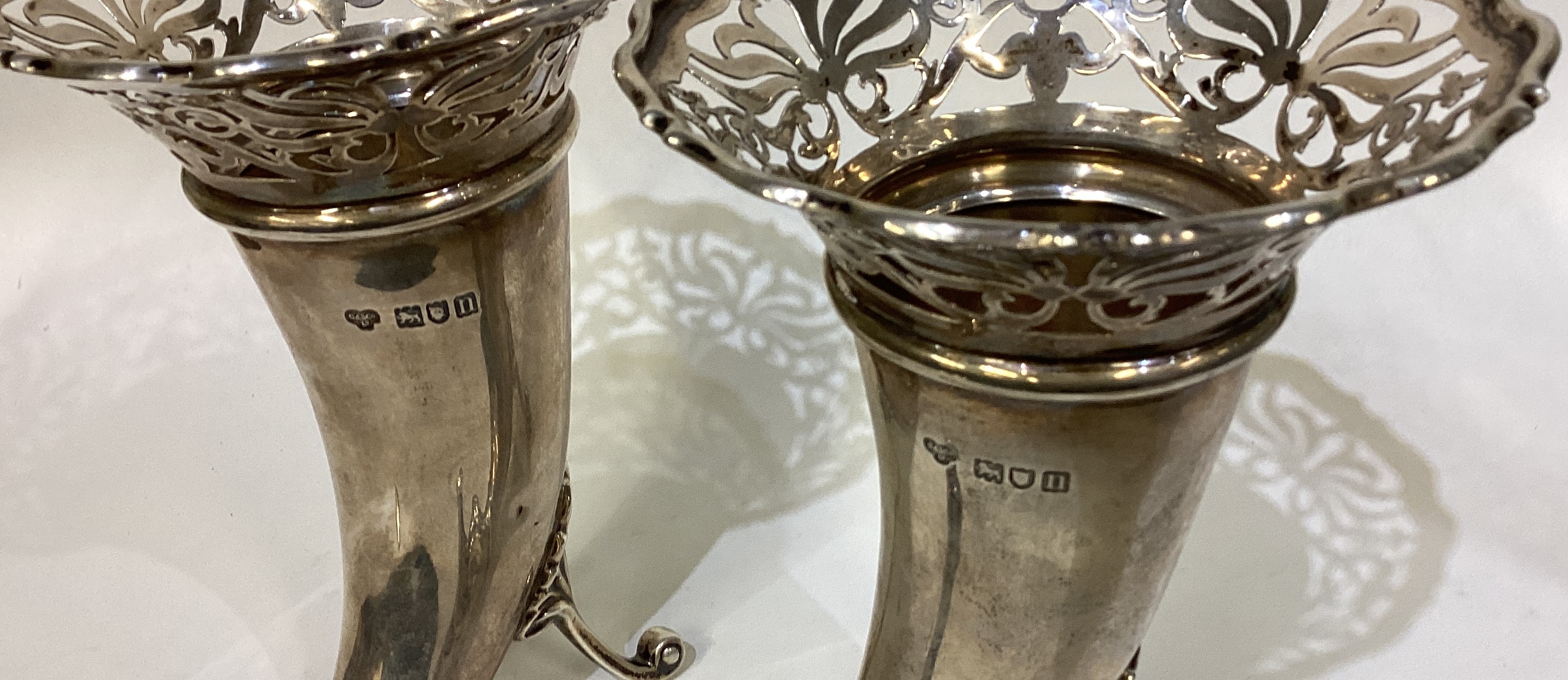 A pair of pierced silver vases in the form of dolphins. - Image 3 of 3