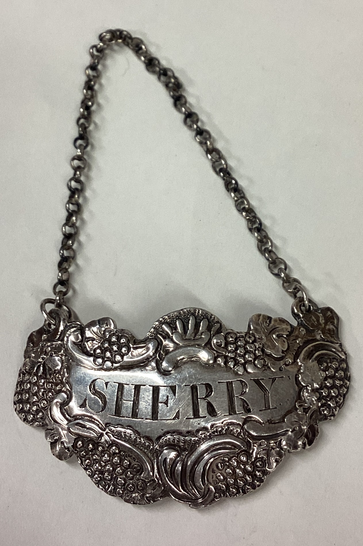 A large and heavy cast silver wine label for 'Sherry'.