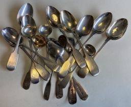 EXETER: A large collection of silver fiddle pattern teaspoons and cruet spoons.