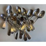 EXETER: A large collection of silver fiddle pattern teaspoons and cruet spoons.