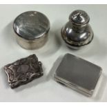 A small silver pill box together with a pepper etc.