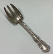 An American silver pastry fork.