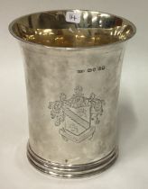 A large Victorian silver beaker with central armorial.