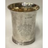 A large Victorian silver beaker with central armorial.