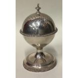 A rare silver sugar caster with screw-top lid.