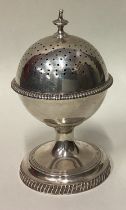 A rare silver sugar caster with screw-top lid.