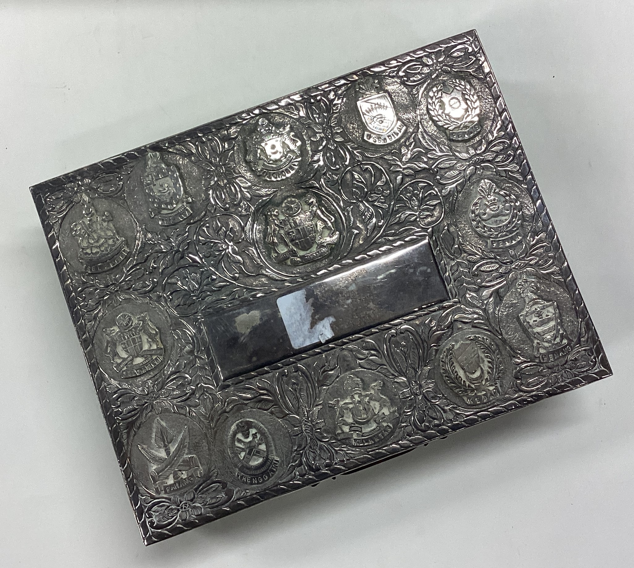 A Persian silver cigar box chased with Malaysian states. - Image 2 of 4