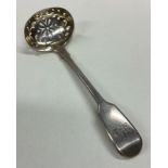 A Victorian silver sifter spoon with pierced decoration.