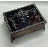 A silver and tortoiseshell jewellery box.