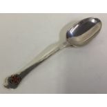 A silver and enamelled rat tail trefid spoon.