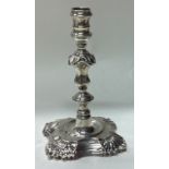 An 18th Century George II silver taperstick.