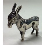A contemporary silver figure of a donkey.