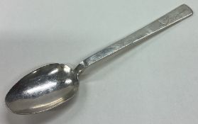 R E STONE: A heavy silver honey spoon.