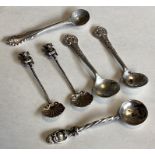 A collection of silver mounted spoons with chased decoration.