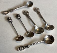 A collection of silver mounted spoons with chased decoration.
