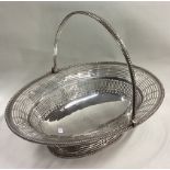 A large and fine 18th Century George III silver swing handled basket.