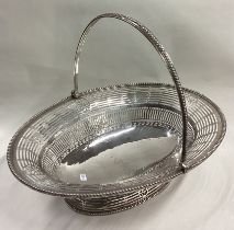 A large and fine 18th Century George III silver swing handled basket.
