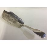 A rare Victorian silver fish slice with engraved fish decoration.