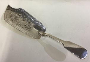 A rare Victorian silver fish slice with engraved fish decoration.