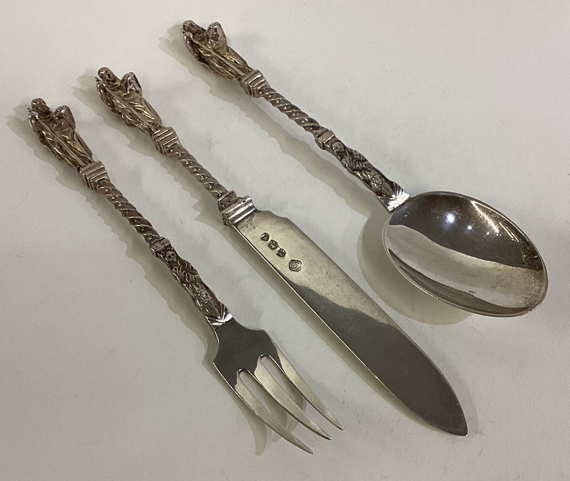 A Victorian silver three-piece Apostle christening set.