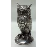 A large novelty silver figure of an owl.