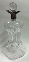 A large silver mounted dimple sided decanter.