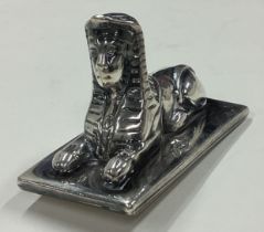 A silver figure of a Sphinx. By Mappin & Webb.