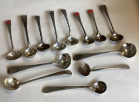 A large collection of Georgian silver OE pattern salt spoons.